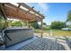Backyard featuring a hot tub, lawn, and patio at 21249 Higgs Dr, Port Charlotte, FL 33952