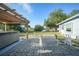 Backyard featuring a patio, hot tub, and lawn at 21249 Higgs Dr, Port Charlotte, FL 33952