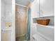 Small bathroom featuring a tiled shower stall and built in storage at 21249 Higgs Dr, Port Charlotte, FL 33952