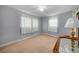 Cozy bedroom featuring carpeting, natural lighting, and neutral paint at 21249 Higgs Dr, Port Charlotte, FL 33952