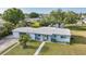 Charming single-story home with a well-manicured lawn and inviting curb appeal at 21249 Higgs Dr, Port Charlotte, FL 33952