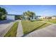Beautiful house with a convenient carport, well-manicured lawn, and decorative front door entrance at 21249 Higgs Dr, Port Charlotte, FL 33952