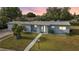 Charming single-story home with a well-manicured lawn and inviting entrance at 21249 Higgs Dr, Port Charlotte, FL 33952