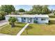 Charming single-story home with well-manicured lawn, walkway, and decorative front door entrance at 21249 Higgs Dr, Port Charlotte, FL 33952