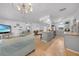 Open-concept living area flows into the kitchen, ideal for entertaining and modern living at 21249 Higgs Dr, Port Charlotte, FL 33952