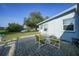 Private outdoor patio area ideal for relaxation and entertaining with a table, chairs and water view at 21249 Higgs Dr, Port Charlotte, FL 33952