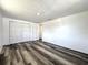 Bedroom featuring luxury vinyl flooring and a closet at 2600 Mohegan Rd, Venice, FL 34293