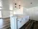 Stylish kitchen island featuring a breakfast bar, pendant lighting, and ample storage space at 2600 Mohegan Rd, Venice, FL 34293