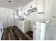 Well-equipped kitchen featuring white cabinets, modern appliances, and easy access to dining at 2600 Mohegan Rd, Venice, FL 34293