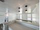 Bright living room featuring pendant lighting and easy access to the exterior at 2600 Mohegan Rd, Venice, FL 34293