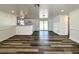 Inviting living space boasting wood floors, recessed lighting, and seamless access to the kitchen at 2600 Mohegan Rd, Venice, FL 34293
