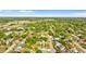 Lush aerial view of a neighborhood filled with mature trees, showcasing the homes and community layout at 2677 Martin St, Sarasota, FL 34237