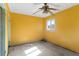 Bright yellow bedroom with natural light from the window, awaiting renovation at 2677 Martin St, Sarasota, FL 34237