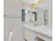 Bathroom with white vanity, an ornate mirror, and neutral-toned walls at 2690 Auburn Blvd, Port Charlotte, FL 33948