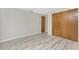 Bedroom with light wood-style flooring and a large closet with double doors at 2690 Auburn Blvd, Port Charlotte, FL 33948