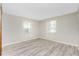 Comfortable bedroom featuring stylish flooring, and two windows that provide natural light at 2690 Auburn Blvd, Port Charlotte, FL 33948