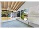 The screened lanai offers outdoor relaxation and views of the backyard and shed at 2690 Auburn Blvd, Port Charlotte, FL 33948
