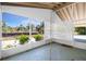 Lanai view showing trees and sky and the chains for a swing at 2690 Auburn Blvd, Port Charlotte, FL 33948