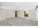 Open layout showcasing new flooring that flows into the dining and kitchen areas at 2690 Auburn Blvd, Port Charlotte, FL 33948