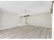 Open-concept living space featuring new flooring and access to other rooms at 2690 Auburn Blvd, Port Charlotte, FL 33948