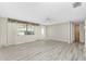Spacious living room with new floors, window, and neutral paint at 2690 Auburn Blvd, Port Charlotte, FL 33948