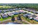 Expansive aerial shot of a residential area showcasing multiple homes with well-manicured lawns at 28059 Arrowhead Cir, Punta Gorda, FL 33982