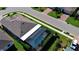 Aerial view of home featuring screen-enclosed pool and well-maintained landscaping in a quiet neighborhood at 28059 Arrowhead Cir, Punta Gorda, FL 33982