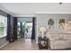 Relaxing living room with neutral tones, sliding glass doors to patio, and comfortable seating at 28059 Arrowhead Cir, Punta Gorda, FL 33982