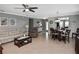 Open-concept living room with a seamless flow to the dining area, providing ample space for relaxation and entertaining at 28059 Arrowhead Cir, Punta Gorda, FL 33982