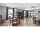 Open concept design joining dining and living areas with modern furnishings and natural light at 28059 Arrowhead Cir, Punta Gorda, FL 33982