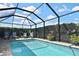 Relaxing screened pool with brick pavers and lounge chairs at 28059 Arrowhead Cir, Punta Gorda, FL 33982