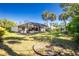 Expansive backyard featuring mature trees and a screened-in pool at 2903 Pope St, North Port, FL 34287