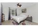 Bright bedroom featuring a ceiling fan, window, and colorful rug at 2903 Pope St, North Port, FL 34287