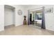 Bright dining area with a view of the patio, clock, and tiled flooring at 2903 Pope St, North Port, FL 34287