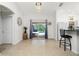 Bright dining room with chandelier, open to the pool area through sliding glass doors at 2903 Pope St, North Port, FL 34287
