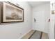 Inviting entryway with tile flooring, neutral paint, modern light fixture, and decorative wall art at 2903 Pope St, North Port, FL 34287