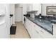 Clean kitchen featuring white cabinets and stainless steel appliances at 2903 Pope St, North Port, FL 34287