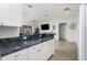Open concept kitchen with granite countertops and white cabinets at 2903 Pope St, North Port, FL 34287