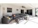 Relaxing screened porch with comfortable seating, ceiling fan, and ample space for outdoor enjoyment at 2903 Pope St, North Port, FL 34287