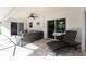 Inviting screened porch with comfortable seating and views of lush greenery at 2903 Pope St, North Port, FL 34287