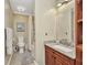 Bathroom boasts granite vanity, framed mirror, shower/tub combo, and neutral wall color at 29324 Leah Rd, Punta Gorda, FL 33982