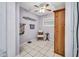 Bathroom featuring a ceiling fan, large cabinet and decorative wall art at 29324 Leah Rd, Punta Gorda, FL 33982