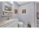 This bathroom features a white vanity, fan and shower at 29324 Leah Rd, Punta Gorda, FL 33982