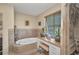 Relaxing bathroom featuring soaking tub and walk in glass shower at 29324 Leah Rd, Punta Gorda, FL 33982