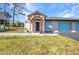 Charming entrance with a decorative pergola, offering a welcoming and stylish arrival to the home at 29324 Leah Rd, Punta Gorda, FL 33982