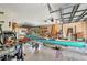 Cluttered garage featuring a canoe, tools, and ample storage space at 29324 Leah Rd, Punta Gorda, FL 33982