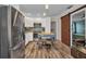 The kitchen has white cabinets, stainless steel appliances, and a movable island at 29324 Leah Rd, Punta Gorda, FL 33982