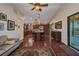 Spacious kitchen features stainless appliances, granite island with seating, dark wood cabinets and hardwood floors at 29324 Leah Rd, Punta Gorda, FL 33982