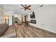 The living room has an open plan with wood-look floors and modern appliances in the kitchen at 29324 Leah Rd, Punta Gorda, FL 33982