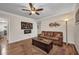 Inviting living room with hardwood floors, an electric fireplace, and comfortable leather seating at 29324 Leah Rd, Punta Gorda, FL 33982